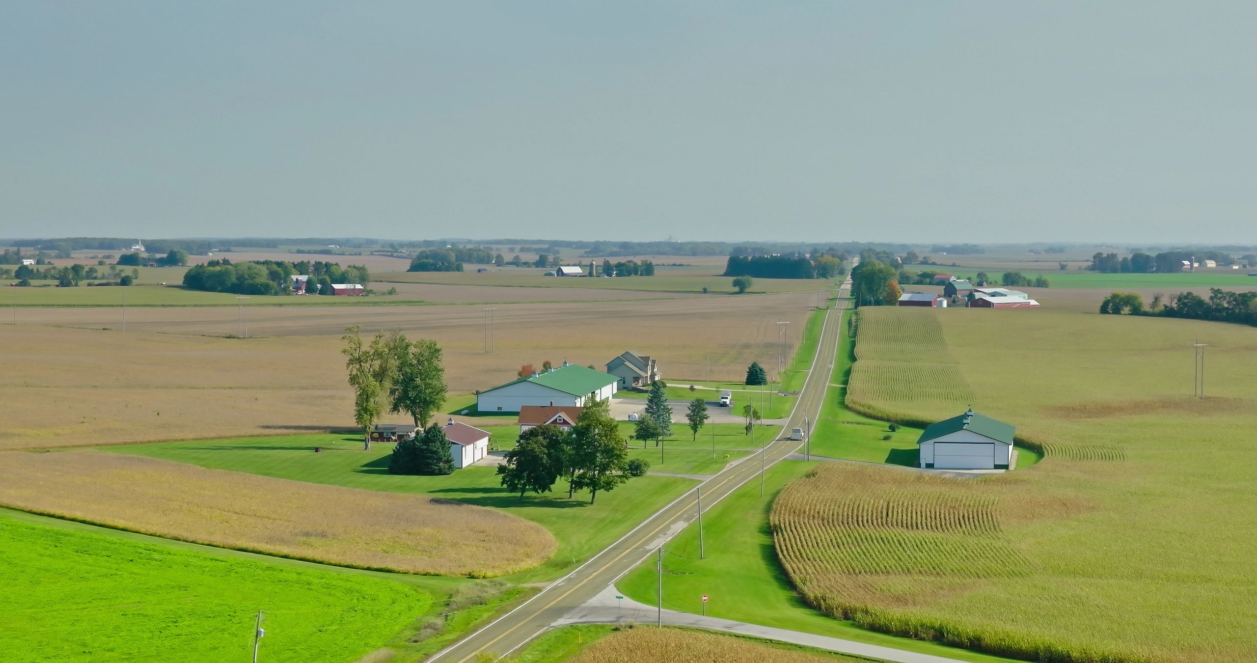 Aerial view of farmland and country road