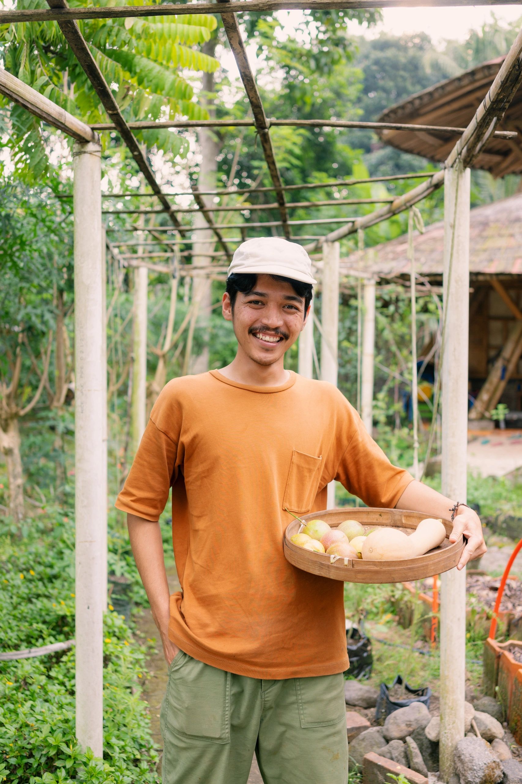 Farmer carrying a basket of freshly harvested produce