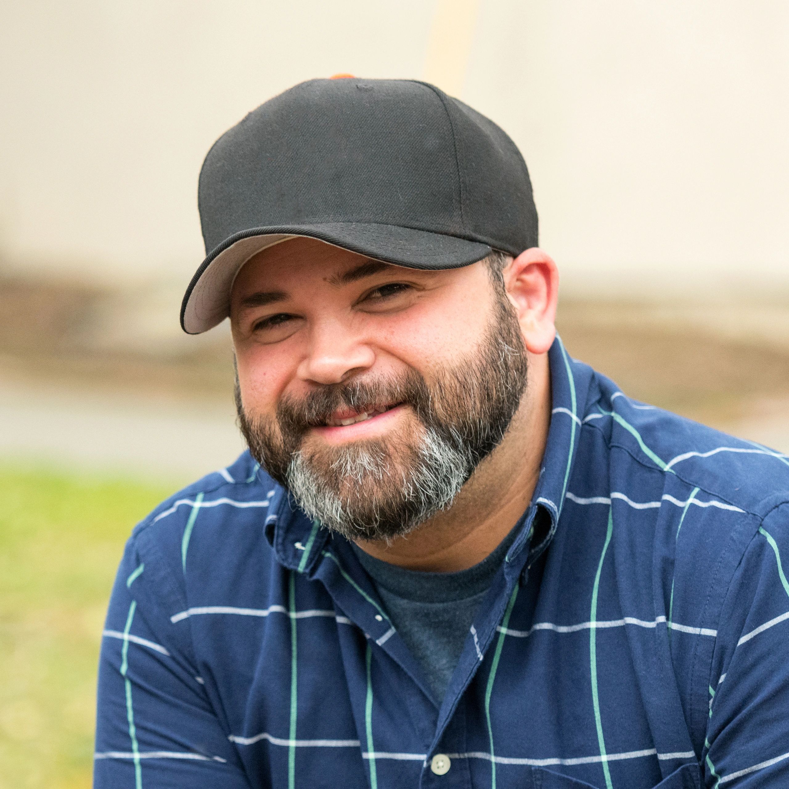 Portrait of a farm team member smiling outdoors